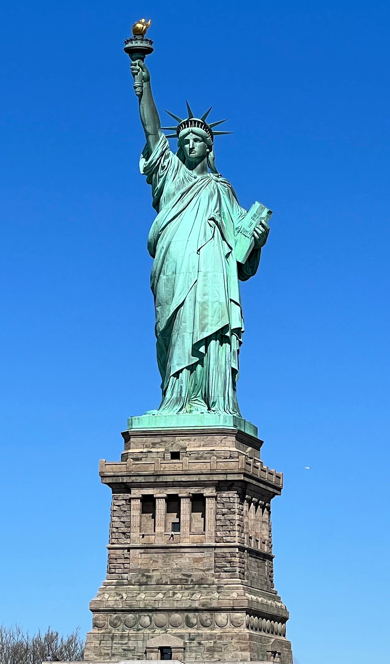 The Statue of Liberty standing on Liberty Island in New York Harbor